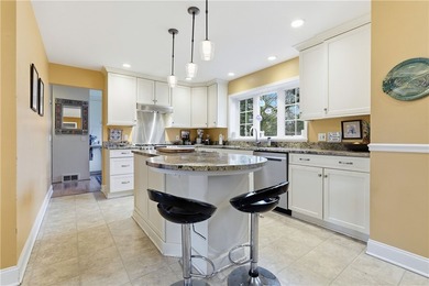 This beautifully updated 4-bedroom, 3.5-bath ranch sits on