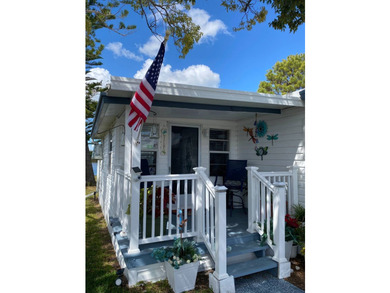 This home has 2 bedrooms, 1.5 bathrooms with a raised 10x16 - photo 6