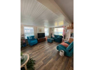 This home has 2 bedrooms, 1.5 bathrooms with a raised 10x16 - photo 8