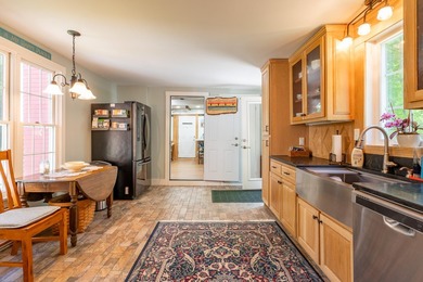 Tastefully renovated and meticulously maintained, this three - photo 4