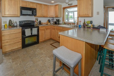 Take in sweeping views of Sebago Lake from the porch, dock, deck - photo 10