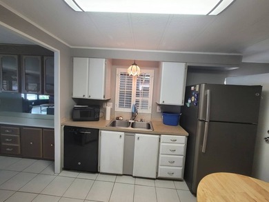 The property features a New roof and tile flooring throughout - photo 3