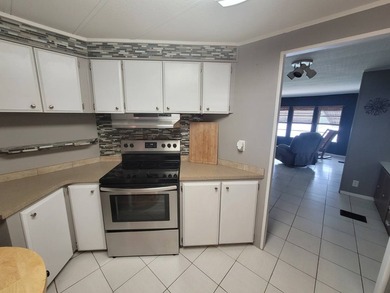 The property features a New roof and tile flooring throughout - photo 4