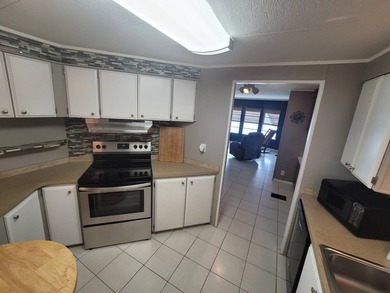 The property features a New roof and tile flooring throughout - photo 8