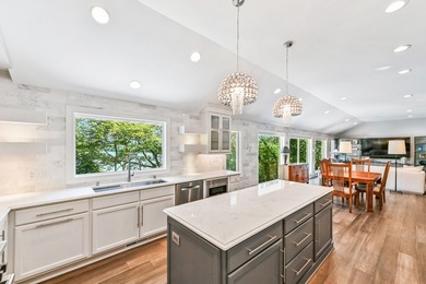 Fully renovated in 2022, this luxurious 4BR, 4.5BA lakefront - photo 11