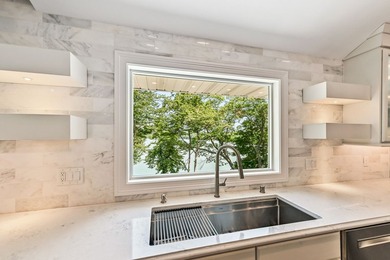 Fully renovated in 2022, this luxurious 4BR, 4.5BA lakefront - photo 13