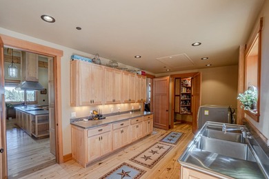 Set on 400 acres of private, gated, fully fenced land, this - photo 20