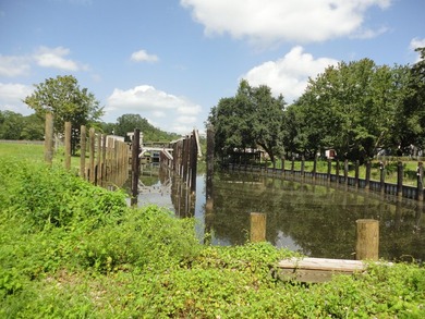 13.14 +/- acres located on Highway 90 has a bulk head on the - photo 4