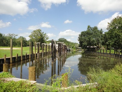 13.14 +/- acres located on Highway 90 has a bulk head on the - photo 6