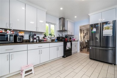 This beautifully renovated two-family home in a highly desirable - photo 7