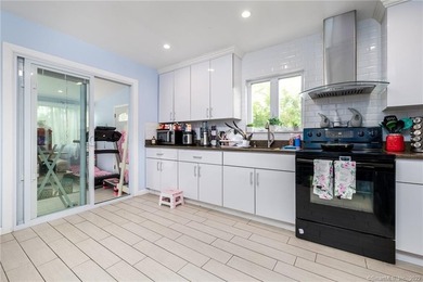 This beautifully renovated two-family home in a highly desirable - photo 8