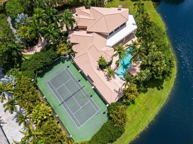 Nestled on a serene cul-de-sac within the prestigious gated - photo 1