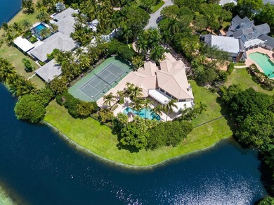 Nestled on a serene cul-de-sac within the prestigious gated - photo 2