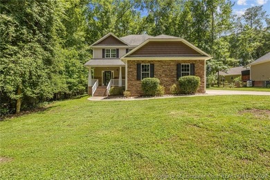 Welcome to the gated community of Carolina Trace! With over 2 - photo 1