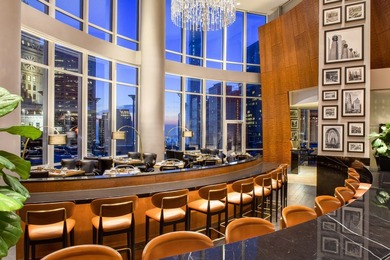 Perched 1,000 feet above the city skyline on the 79th floor is - photo 39