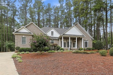 Nestled on a beautifully landscaped 1.17-acre lot in a lovely - photo 3