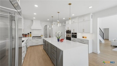 Welcome to 8711 Deer Leap, an extraordinary luxury estate on a - photo 13