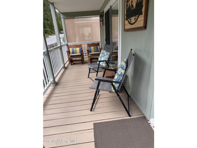 Enjoy lake and mountain views from your covered deck, a - photo 8