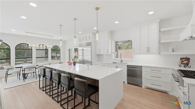 Welcome to 8711 Deer Leap, an extraordinary luxury estate on a - photo 20