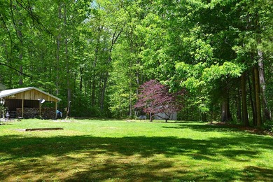 Nestled in the woods on a peaceful 3.169-acre lot, this inviting - photo 21