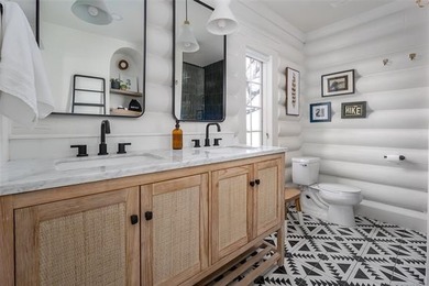 Rustic charm meets modern comfort in this beautifully log cabin - photo 18