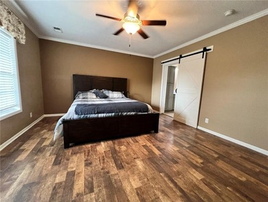 Well-maintained home on approximately 6 acres with a stocked