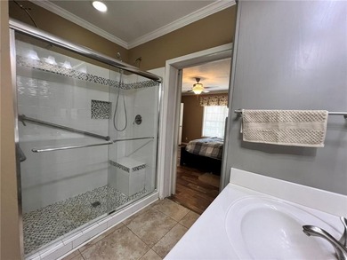 Well-maintained home on approximately 6 acres with a stocked