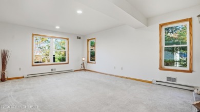 WELCOME TO 104 WOLF HOLLOW RD, A GOLF LOVERS DREAM!! This