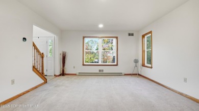 WELCOME TO 104 WOLF HOLLOW RD, A GOLF LOVERS DREAM!! This