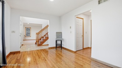 WELCOME TO 104 WOLF HOLLOW RD, A GOLF LOVERS DREAM!! This