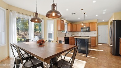 WELCOME TO 104 WOLF HOLLOW RD, A GOLF LOVERS DREAM!! This