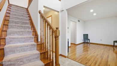 WELCOME TO 104 WOLF HOLLOW RD, A GOLF LOVERS DREAM!! This