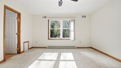 WELCOME TO 104 WOLF HOLLOW RD, A GOLF LOVERS DREAM!! This