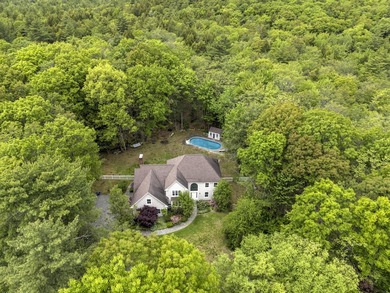 Tucked away on a beautifully landscaped 1.72-acre lot and - photo 2