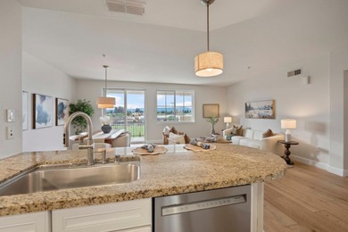 Stunning third-floor condo with serene hill views, flooding the