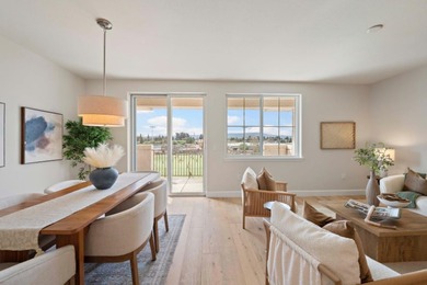 Stunning third-floor condo with serene hill views, flooding the