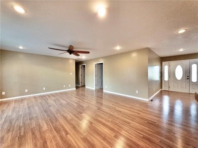 This well-kept five-bedroom, three-bath home offers over 3,700