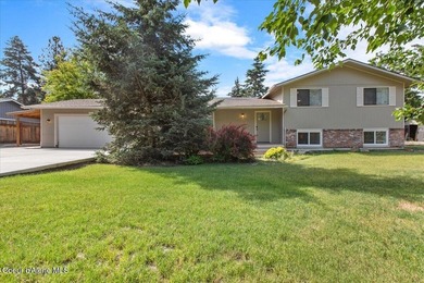 Beautifully updated 4-bedroom, 2.5-bath tri-level home in one of - photo 1