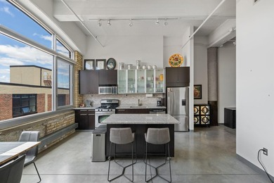 Live in the heart of the North Loop at Tower Lofts. This - photo 10