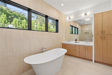 Newly completed and design-driven, this waterfront home makes a - photo 13