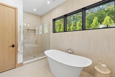 Newly completed and design-driven, this waterfront home makes a - photo 14
