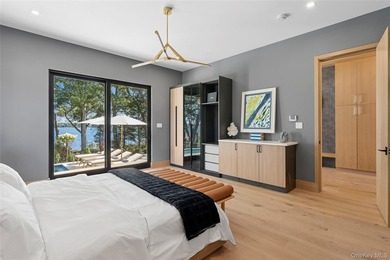 Newly completed and design-driven, this waterfront home makes a - photo 16