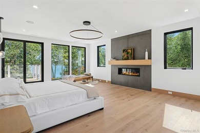 Newly completed and design-driven, this waterfront home makes a - photo 18