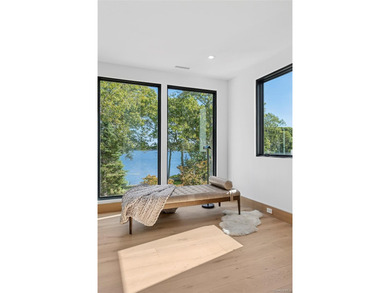 Newly completed and design-driven, this waterfront home makes a - photo 20