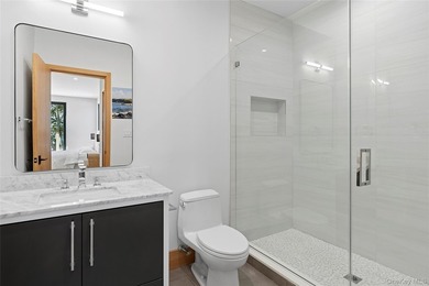 Newly completed and design-driven, this waterfront home makes a - photo 24