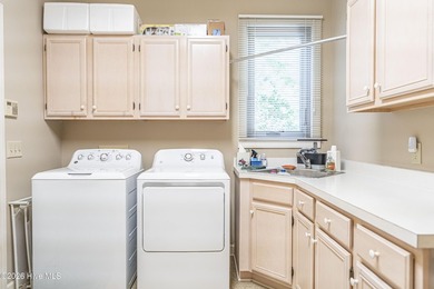 Located in the Pinehurst No. 6 neighborhood, this custom-built - photo 44