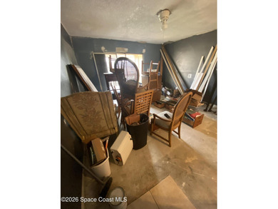 This 2nd floor unit is a handyman's delight. Tear out has been