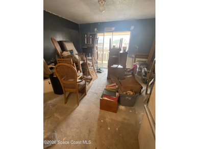 This 2nd floor unit is a handyman's delight. Tear out has been