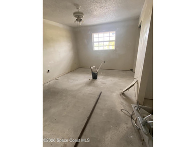 This 2nd floor unit is a handyman's delight. Tear out has been