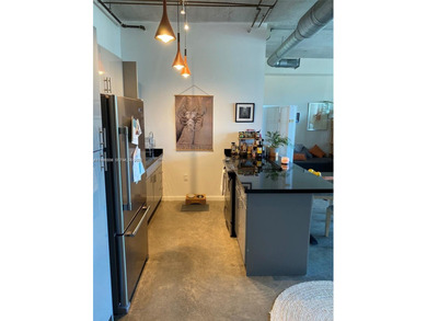 Live the ultimate Miami loft lifestyle in this expansive 2BR/2BA